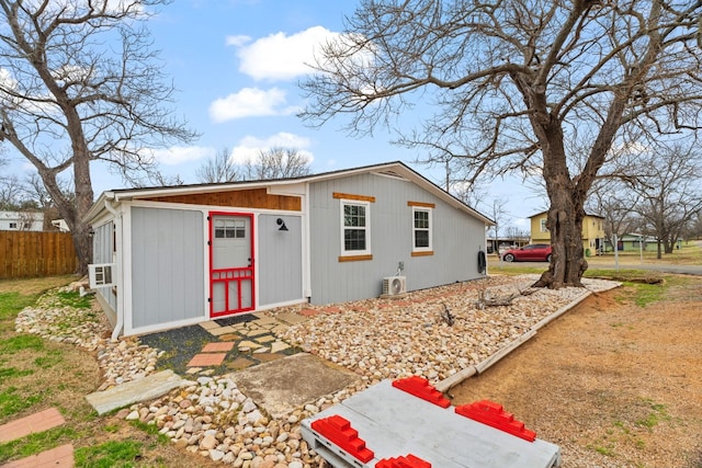 view of front of home featuring fence