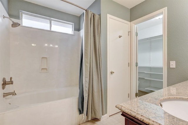 5006 Daymon Ct, Hutto, TX 78634 - full bath with shower / tub combo with curtain, vanity, a walk in closet, and tile patterned floors