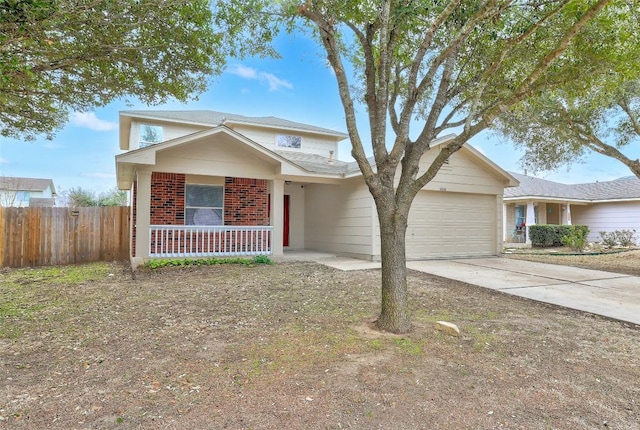 traditional-style home with driveway, an attached garage, covered porch, fence, and brick siding