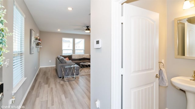 6205 Conestoga Wagon Way, Del Valle, TX 78617 - bathroom featuring ceiling fan, wood finished floors, recessed lighting, baseboards, and a sink