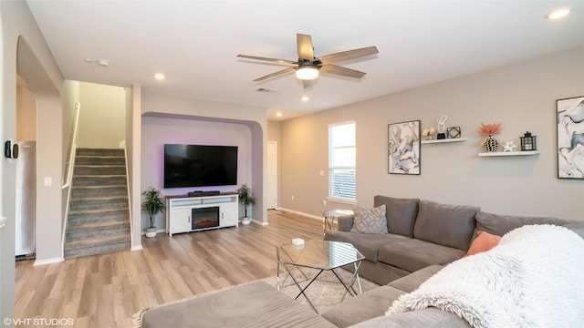 6205 Conestoga Wagon Way, Del Valle, TX 78617 - living area with stairs, ceiling fan, light wood finished floors, baseboards, and recessed lighting