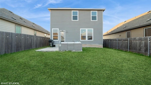 6205 Conestoga Wagon Way, Del Valle, TX 78617 - back of property with a patio area and outdoor lounge area
