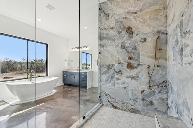 138 Cloudwood Ranch Rd, Briggs, TX 78608 - bathroom featuring a marble finish shower, vanity, a soaking tub, finished concrete flooring, and recessed lighting
