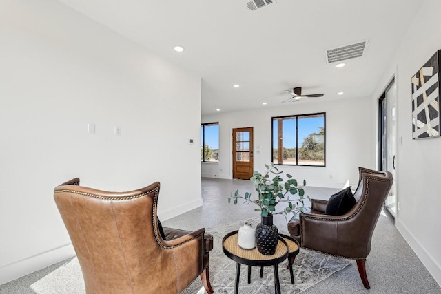 sitting room featuring baseboards, visible vents, and recessed lighting