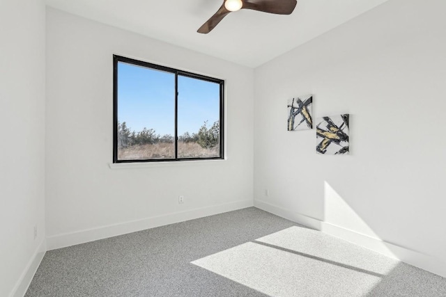 unfurnished room with carpet, ceiling fan, and baseboards