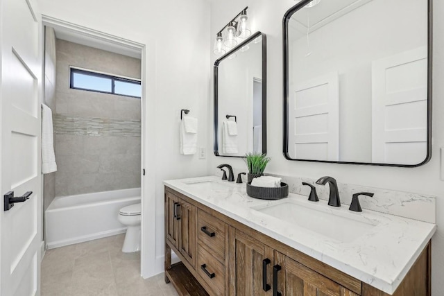 full bathroom with tile patterned floors, a sink, toilet, and double vanity