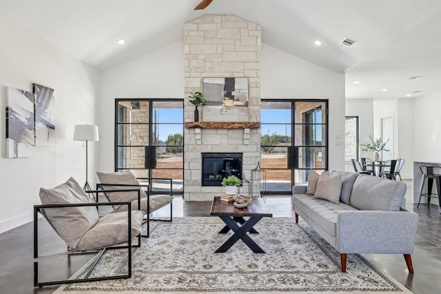 138 Cloudwood Ranch Rd, Briggs, TX 78608 - living area featuring a stone fireplace, high vaulted ceiling, concrete flooring, recessed lighting, and a ceiling fan