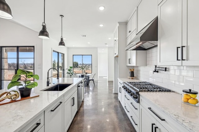 138 Cloudwood Ranch Rd, Briggs, TX 78608 - kitchen featuring extractor fan, decorative backsplash, stainless steel appliances, recessed lighting, and light stone countertops