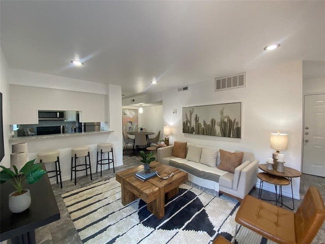 living room with visible vents and recessed lighting