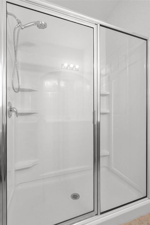 full bathroom with a shower stall