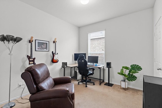 office space with light carpet and baseboards