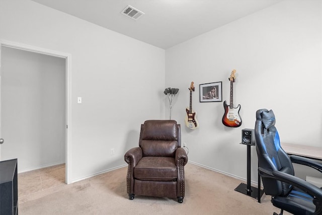 office space with light carpet, baseboards, and visible vents