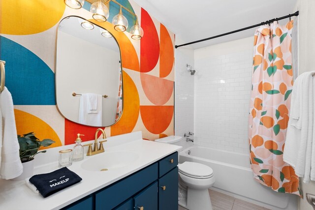 902 E Live Oak St, Austin, TX 78704 - bathroom featuring vanity, shower / bathtub combination with curtain, toilet, and tile patterned floors