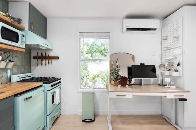 902 E Live Oak St, Austin, TX 78704 - kitchen featuring a wall mounted AC, white appliances, exhaust hood, a desk, and backsplash