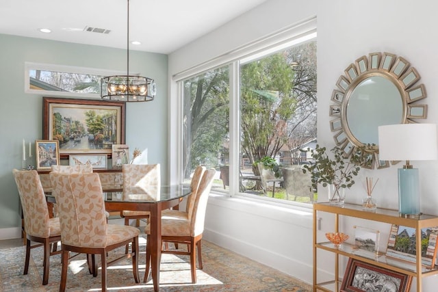 dining space with a chandelier, recessed lighting, visible vents, and baseboards