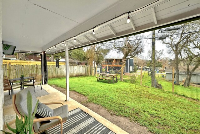 3010 Burleson Rd Unit A, Austin, TX 78741 - fenced backyard with a patio area and outdoor dining space