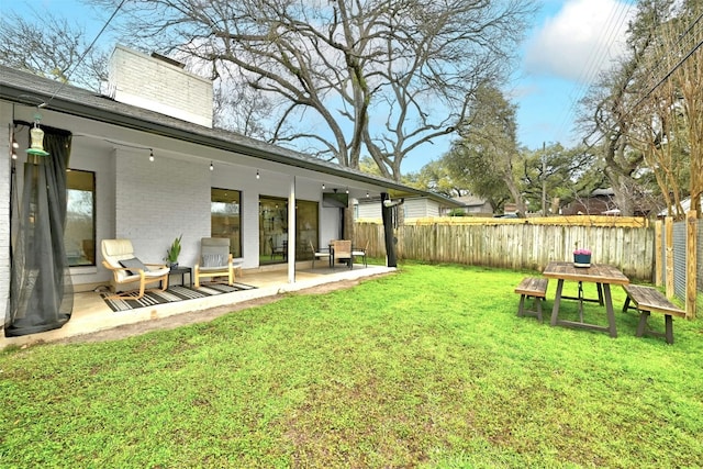 view of yard featuring a fenced backyard and a patio