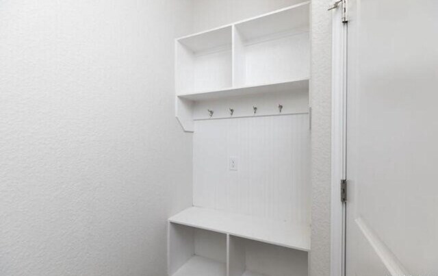 mudroom featuring a textured wall