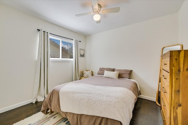 bedroom featuring dark wood finished floors, baseboards, and ceiling fan