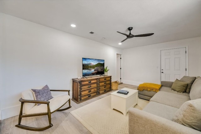 living room featuring visible vents, baseboards, ceiling fan, light wood-style floors, and recessed lighting