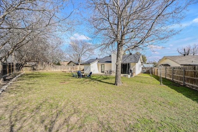 view of yard featuring a fenced backyard