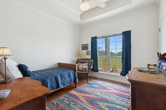 201 Hillview Cir, Dripping Springs, TX 78620 - bedroom featuring a raised ceiling, ornamental molding, wood finished floors, and ceiling fan