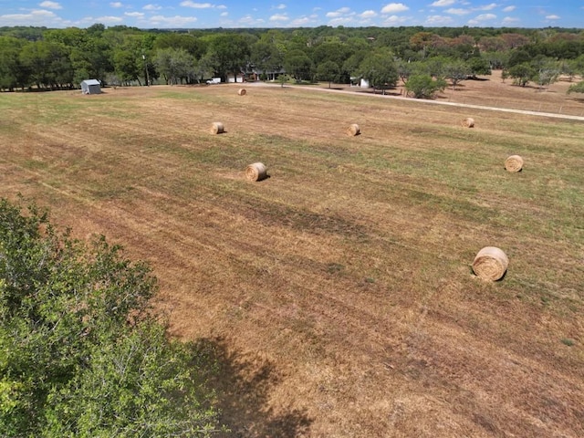 birds eye view of property with a rural view