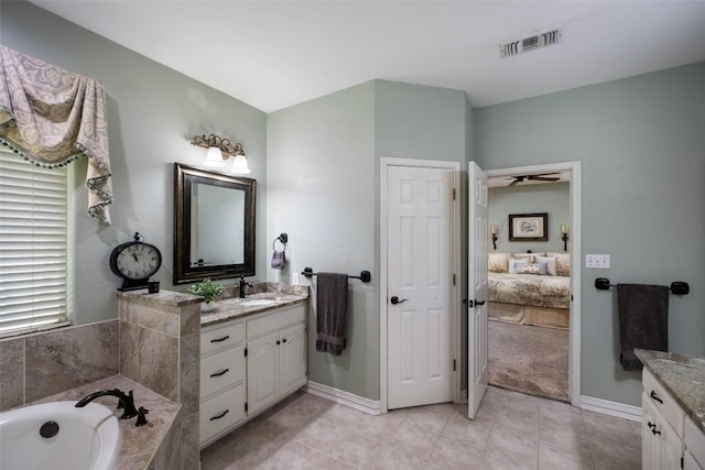 full bath featuring ensuite bathroom, vanity, visible vents, a bath, and tile patterned floors