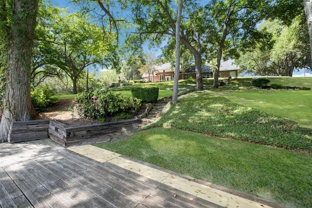 exterior space featuring a deck and a yard