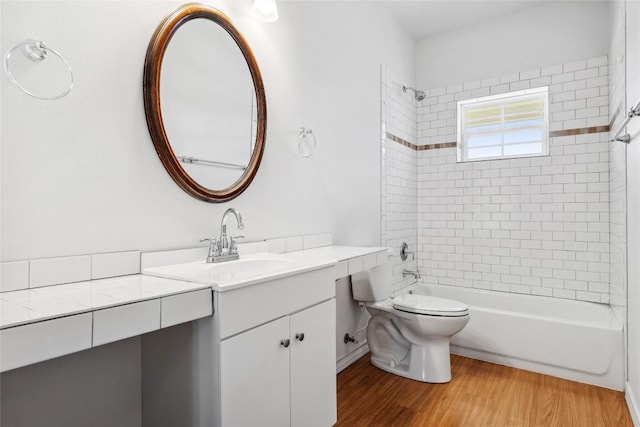 826 Savannah Cv, Elgin, TX 78621 - full bathroom with vanity, bathing tub / shower combination, wood finished floors, and toilet