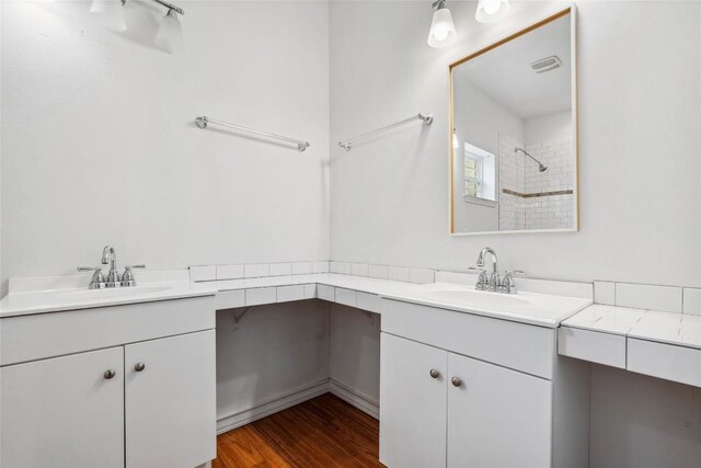826 Savannah Cv, Elgin, TX 78621 - full bathroom featuring vanity, a shower, and wood finished floors