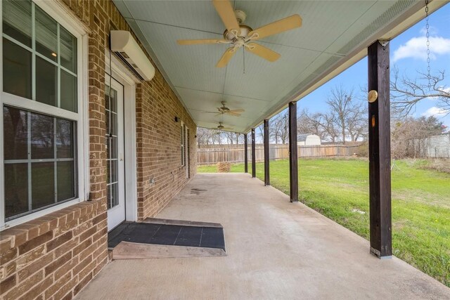 826 Savannah Cv, Elgin, TX 78621 - view of patio with an AC wall unit and a ceiling fan