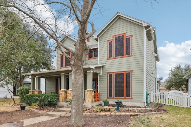 view of front of house featuring fence