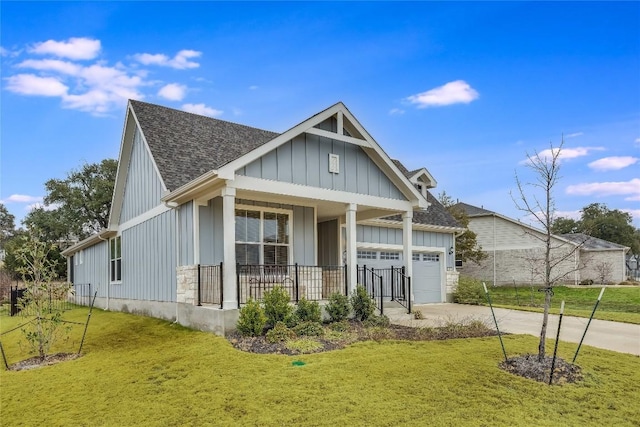 view of front of property with board and batten siding, covered porch, an attached garage, and concrete driveway