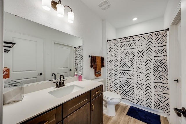 331 Kitty Hawk Rd, Georgetown, TX 78633 - bathroom with vanity, wood finished floors, and a shower with curtain