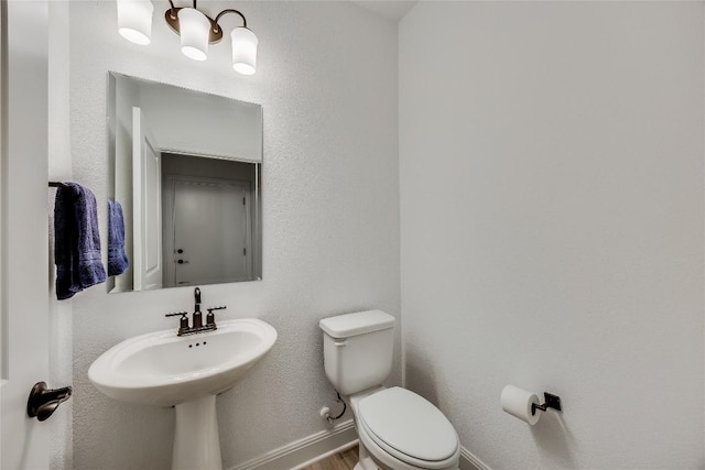 331 Kitty Hawk Rd, Georgetown, TX 78633 - bathroom with a chandelier and wood finished floors