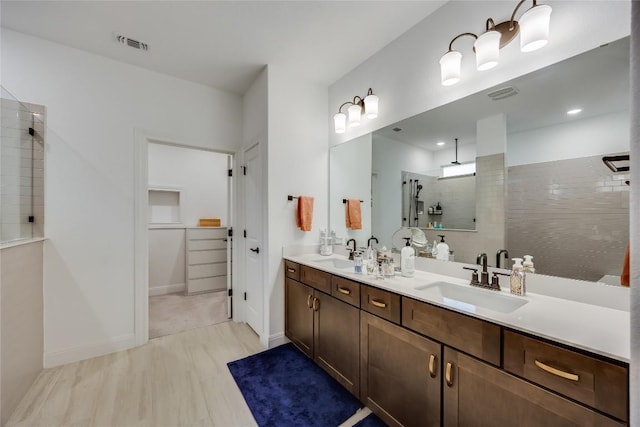 331 Kitty Hawk Rd, Georgetown, TX 78633 - bathroom with a walk in shower, double vanity, and a walk in closet