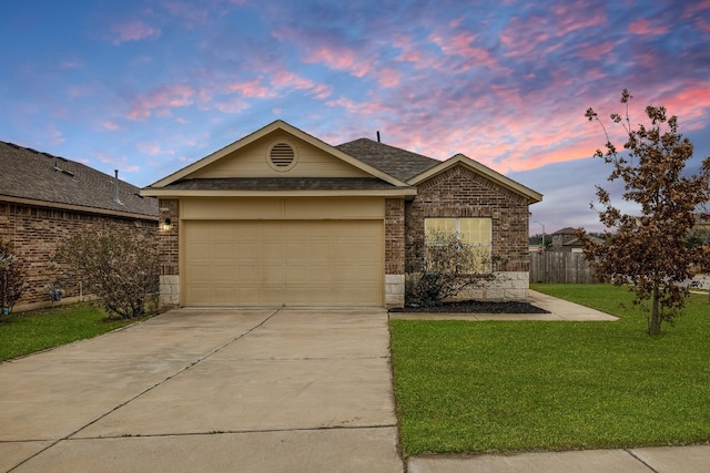 ranch-style house featuring concrete driveway, brick siding, and a front lawn