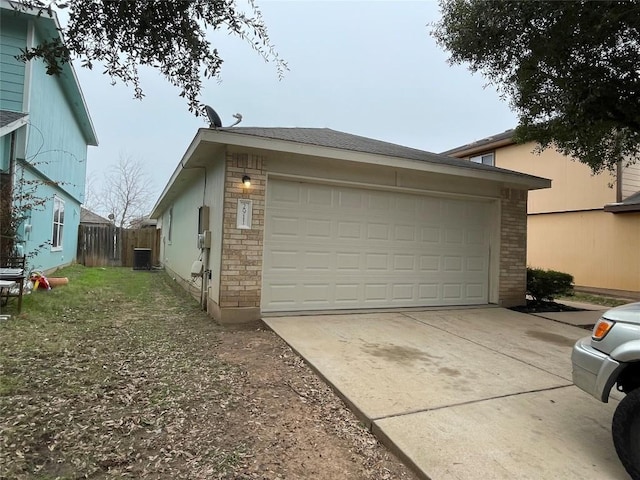 exterior space featuring concrete driveway and central AC