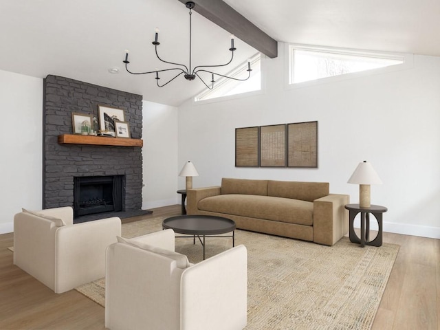 8205 Alabama Dr, Austin, TX 78745 - living area featuring wood finished floors, a chandelier, and a large fireplace