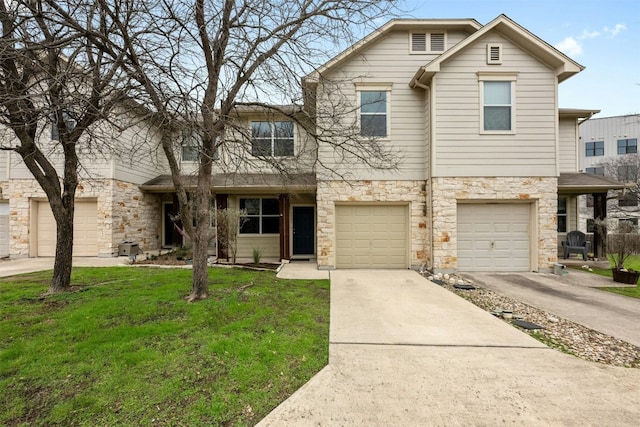 view of front of house featuring a garage, stone siding, concrete driveway, and a front yard