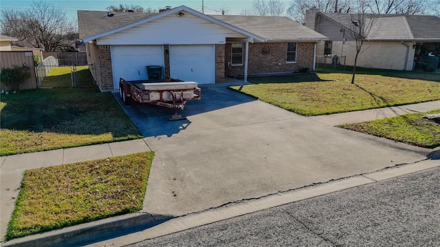 single story home featuring brick siding, a chimney, a garage, driveway, and a front lawn