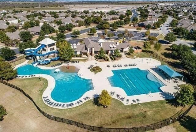 view of pool with a residential view