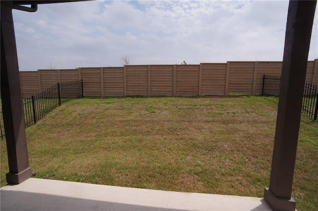 view of yard with a fenced backyard