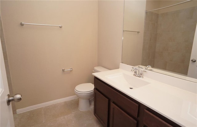 409 Epiphany Ln, Pflugerville, TX 78660 - bathroom featuring toilet, vanity, a tile shower, and baseboards