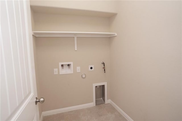 laundry area with laundry area, baseboards, gas dryer hookup, hookup for an electric dryer, and washer hookup