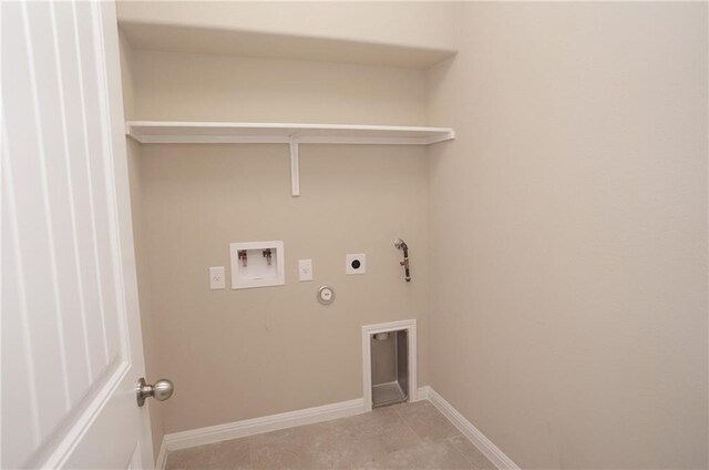 409 Epiphany Ln, Pflugerville, TX 78660 - laundry room with hookup for a gas dryer, electric dryer hookup, hookup for a washing machine, light tile patterned flooring, and baseboards