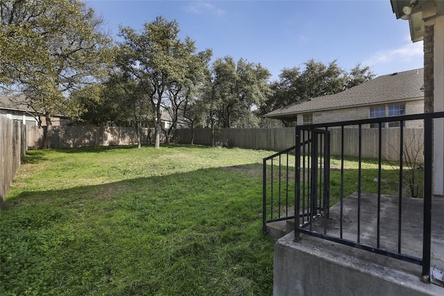 view of yard with a fenced backyard