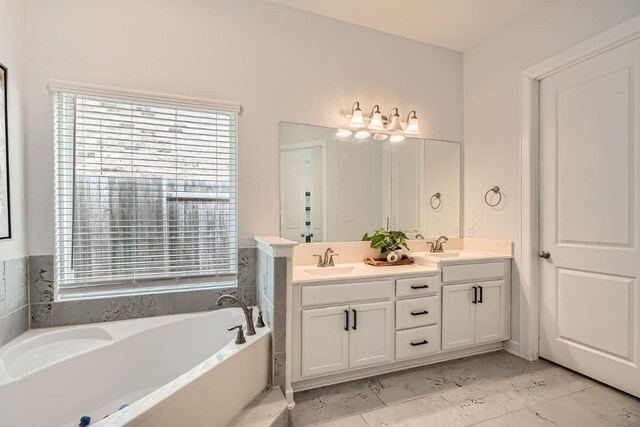 582 Wild Pecan Loop, Buda, TX 78610 - full bath with double vanity and a garden tub