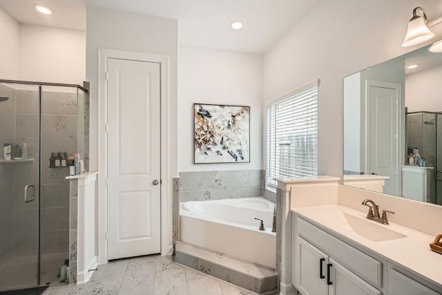 bathroom with marble finish floor, a garden tub, recessed lighting, a stall shower, and vanity